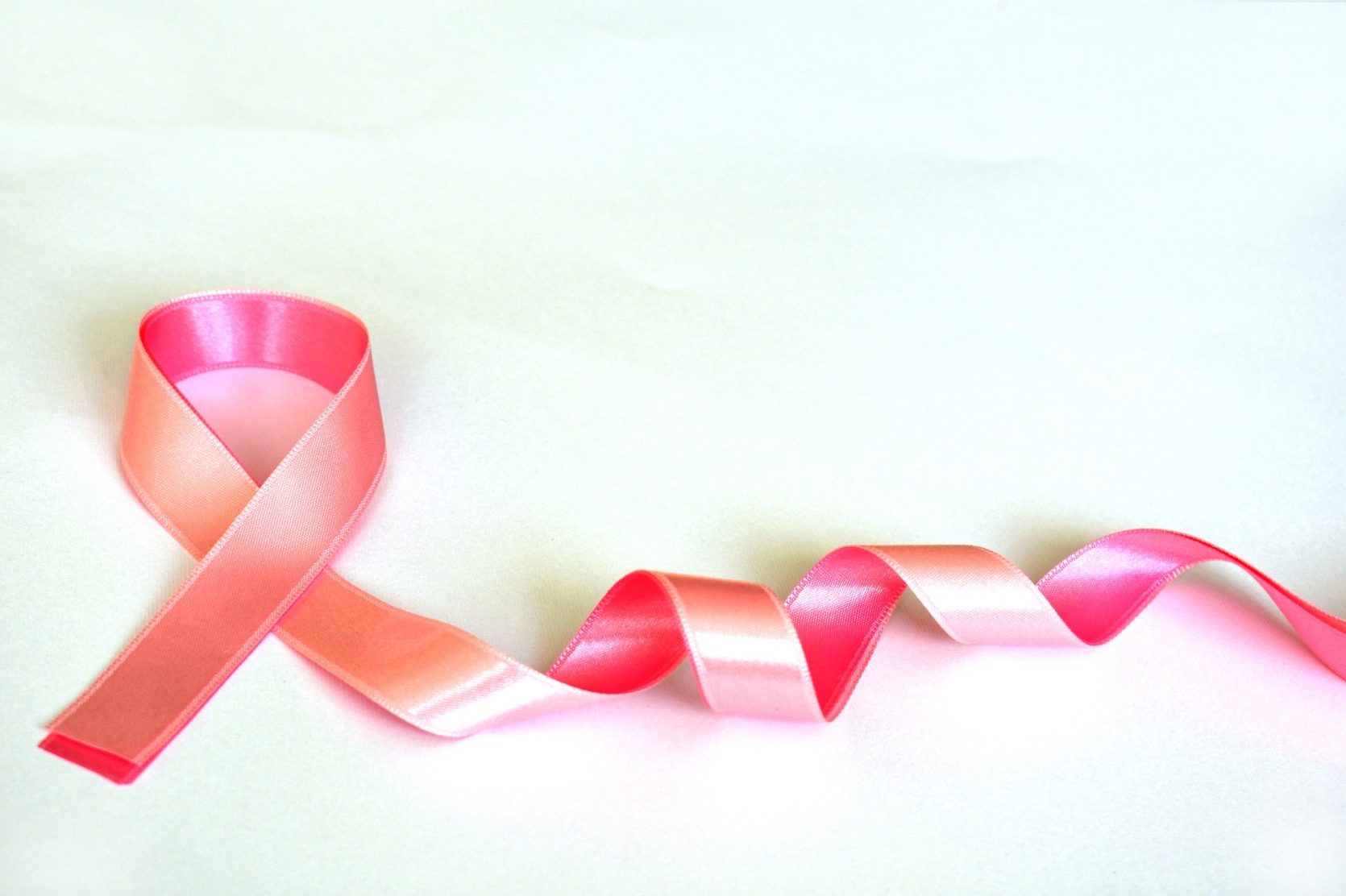 A pink ribbon, representing breast cancr